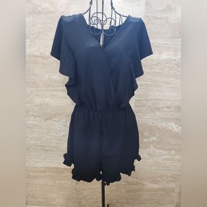 Black romper with ruffled bottoms